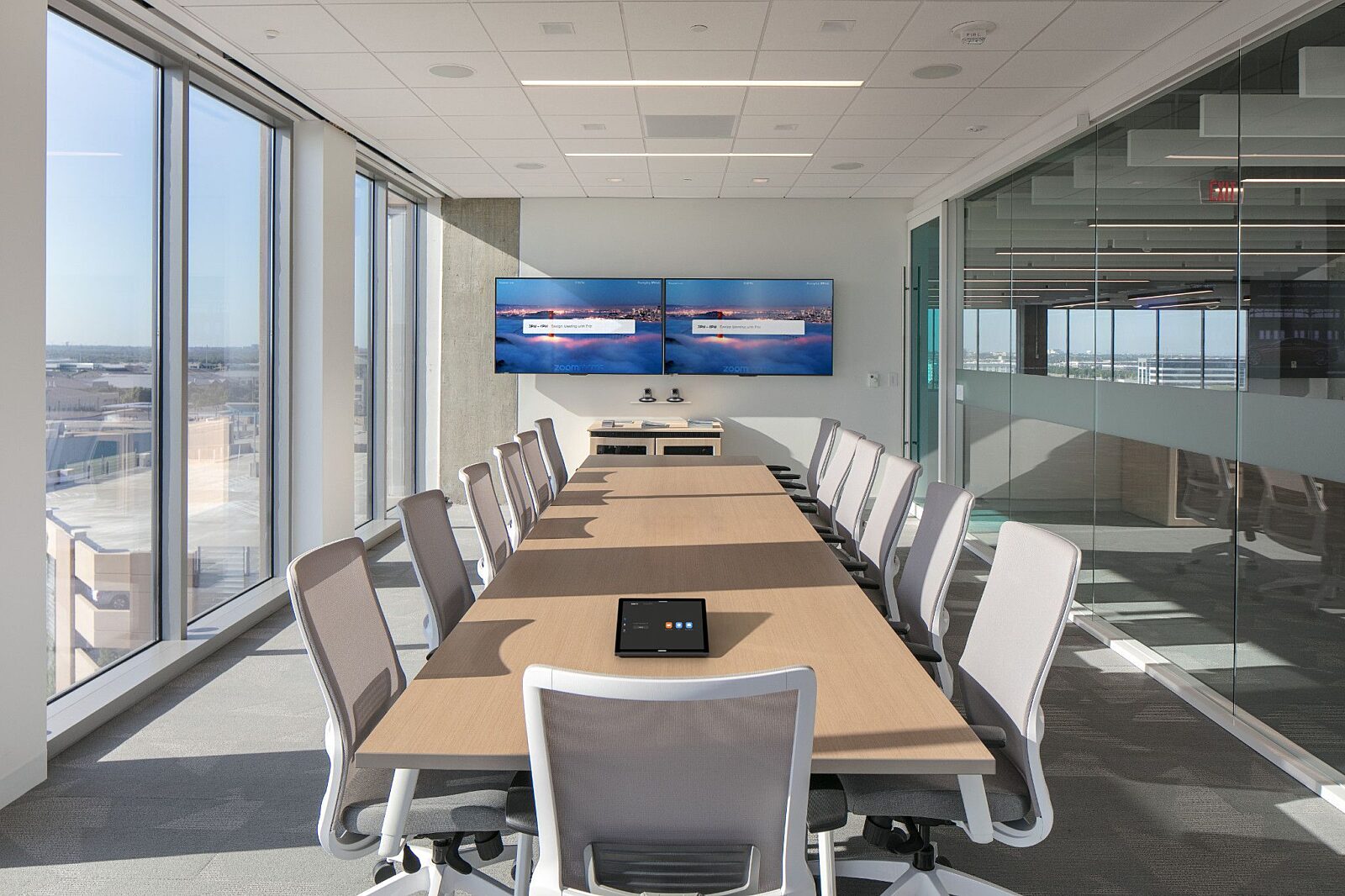 large empty conference room with windows on either side