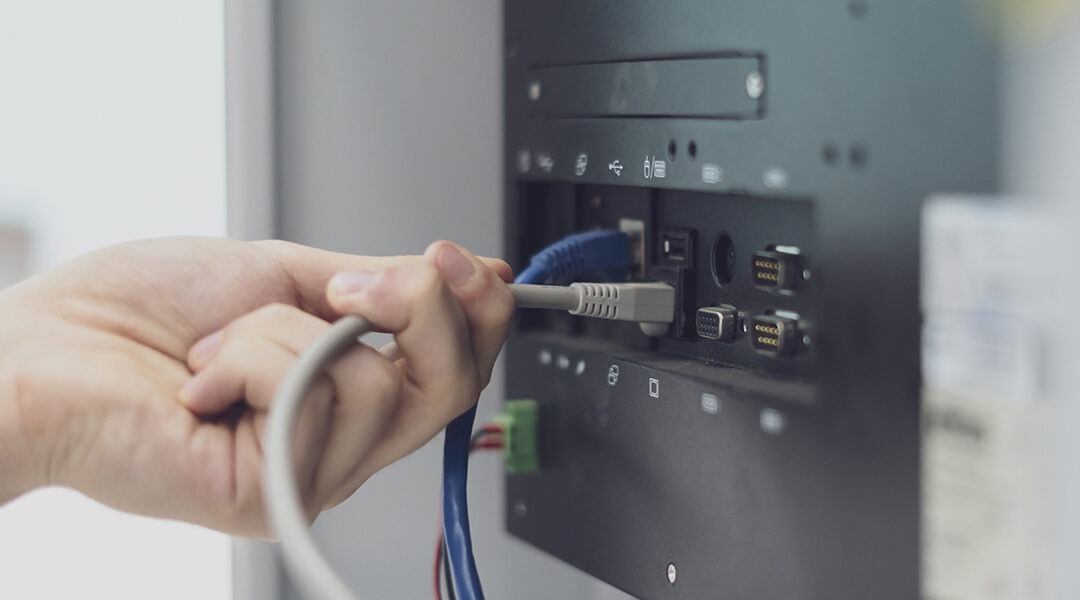 AV expert installing chord in AV panel