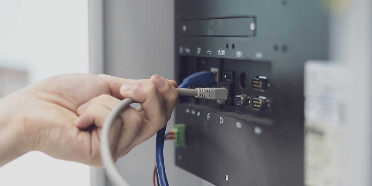 AV expert installing chord in AV panel